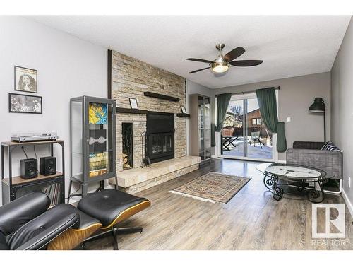 4676 16A Avenue, Edmonton, AB - Indoor Photo Showing Living Room With Fireplace