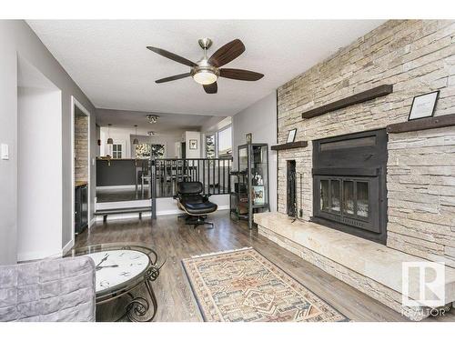 4676 16A Avenue, Edmonton, AB - Indoor Photo Showing Living Room With Fireplace