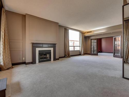 12A 10050 118 Street, Edmonton, AB - Indoor Photo Showing Living Room With Fireplace