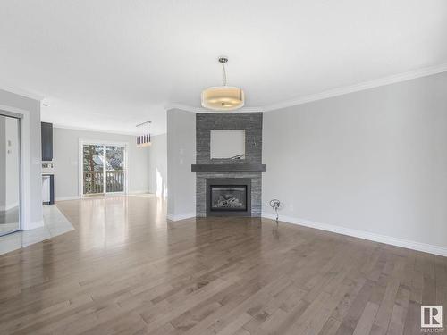 1 17839 99 Street, Edmonton, AB - Indoor Photo Showing Living Room With Fireplace