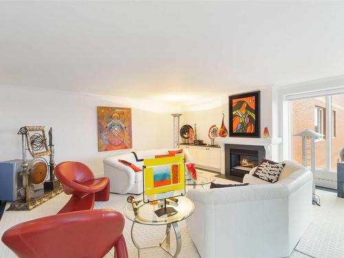 703 10010 119 Street, Edmonton, AB - Indoor Photo Showing Living Room With Fireplace