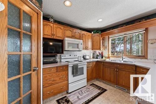 11415 9 Avenue, Edmonton, AB - Indoor Photo Showing Kitchen With Double Sink