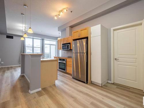 210 10147 112 Street, Edmonton, AB - Indoor Photo Showing Kitchen With Stainless Steel Kitchen