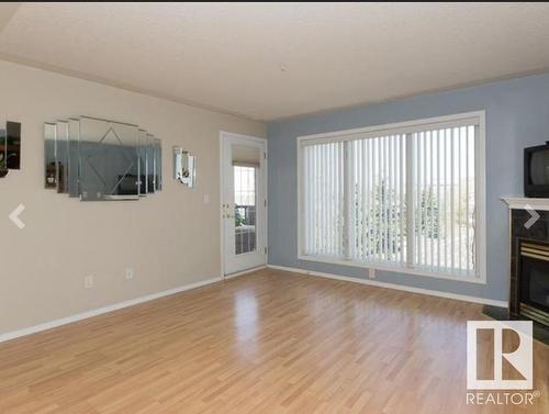 308 237 Youville Drive, Edmonton, AB - Indoor Photo Showing Living Room With Fireplace