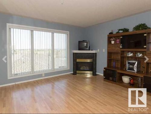 308 237 Youville Drive, Edmonton, AB - Indoor Photo Showing Living Room With Fireplace