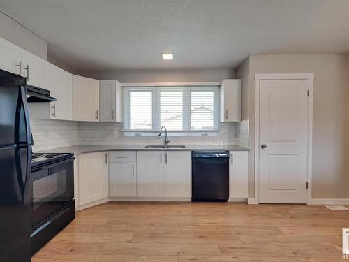 7408 149A Avenue, Edmonton, AB - Indoor Photo Showing Kitchen With Double Sink