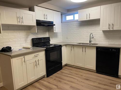 7408 149A Avenue, Edmonton, AB - Indoor Photo Showing Kitchen With Double Sink