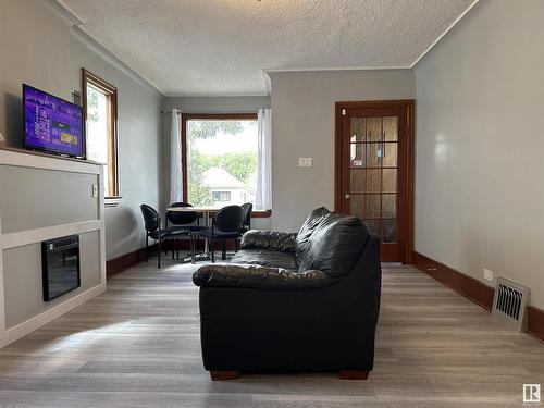 12063 94 Street, Edmonton, AB - Indoor Photo Showing Living Room With Fireplace