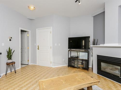 402 10728 82 Avenue, Edmonton, AB - Indoor Photo Showing Living Room With Fireplace