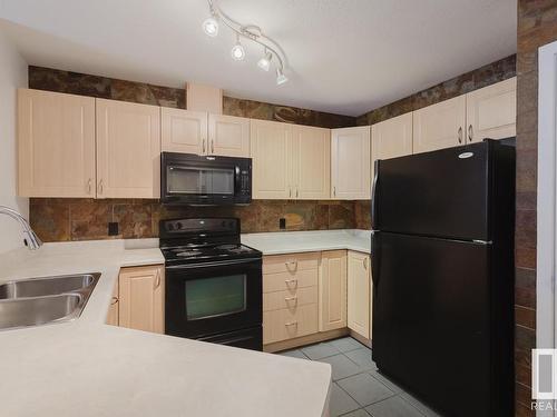 323 4312 139 Avenue, Edmonton, AB - Indoor Photo Showing Kitchen With Double Sink