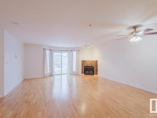 323 4312 139 Avenue, Edmonton, AB - Indoor Photo Showing Living Room With Fireplace