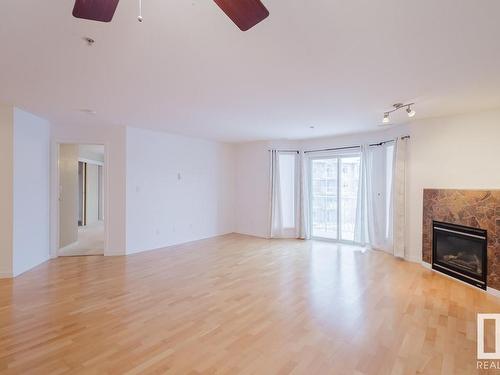 323 4312 139 Avenue, Edmonton, AB - Indoor Photo Showing Living Room With Fireplace