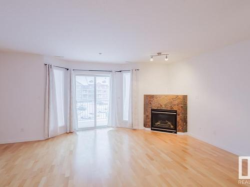 323 4312 139 Avenue, Edmonton, AB - Indoor Photo Showing Living Room With Fireplace