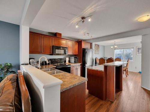 14 3751 12 Street, Edmonton, AB - Indoor Photo Showing Kitchen With Double Sink