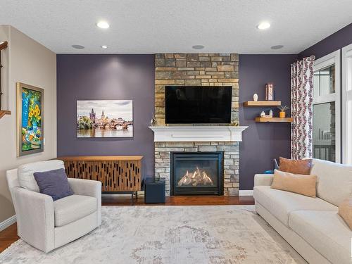 2205 Warry Loop, Edmonton, AB - Indoor Photo Showing Living Room With Fireplace