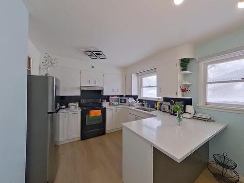 7928 82 Ave, Edmonton, AB - Indoor Photo Showing Kitchen With Double Sink