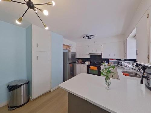 7928 82 Ave, Edmonton, AB - Indoor Photo Showing Kitchen With Double Sink