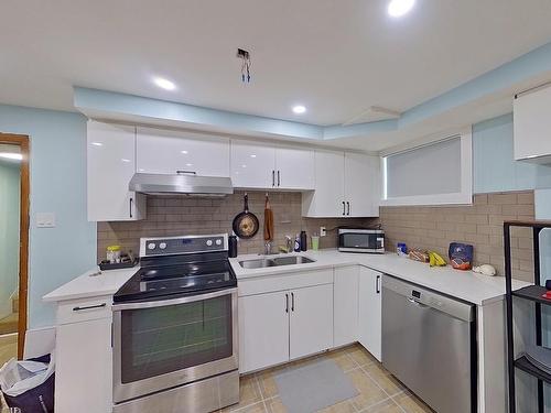 7928 82 Ave, Edmonton, AB - Indoor Photo Showing Kitchen With Double Sink