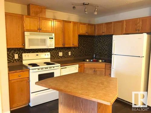 216 12550 140 Avenue, Edmonton, AB - Indoor Photo Showing Kitchen With Double Sink