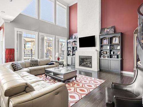 2312 Cameron Ravine Cove Cove, Edmonton, AB - Indoor Photo Showing Living Room With Fireplace