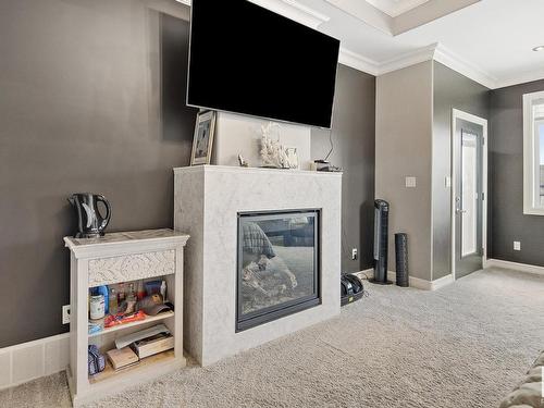 2312 Cameron Ravine Cove Cove, Edmonton, AB - Indoor With Fireplace
