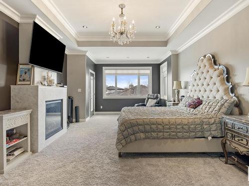 2312 Cameron Ravine Cove Cove, Edmonton, AB - Indoor Photo Showing Bedroom With Fireplace