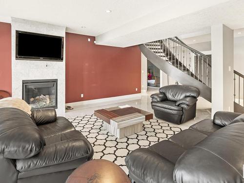 2312 Cameron Ravine Cove Cove, Edmonton, AB - Indoor Photo Showing Living Room With Fireplace