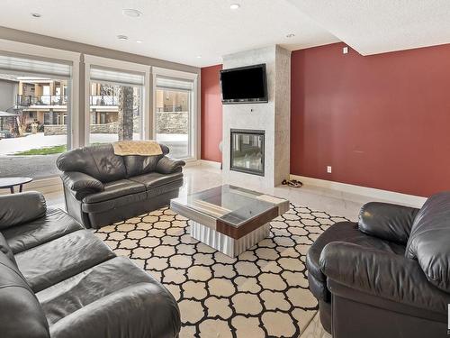 2312 Cameron Ravine Cove Cove, Edmonton, AB - Indoor Photo Showing Living Room With Fireplace