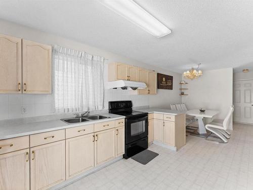 15035 128 Street, Edmonton, AB - Indoor Photo Showing Kitchen With Double Sink