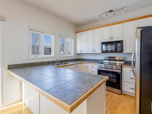 9216 86 Street, Edmonton, AB - Indoor Photo Showing Kitchen With Double Sink