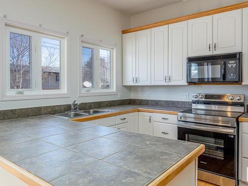 9216 86 Street, Edmonton, AB - Indoor Photo Showing Kitchen With Double Sink