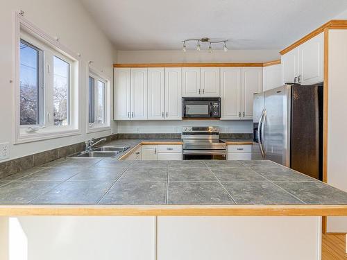 9216 86 Street, Edmonton, AB - Indoor Photo Showing Kitchen With Double Sink