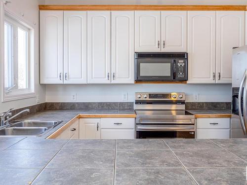 9216 86 Street, Edmonton, AB - Indoor Photo Showing Kitchen With Double Sink