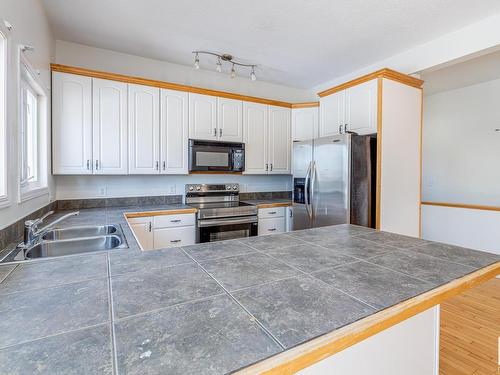 9216 86 Street, Edmonton, AB - Indoor Photo Showing Kitchen With Double Sink