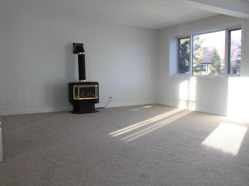 7407 92 Avenue, Edmonton, AB - Indoor Photo Showing Other Room With Fireplace