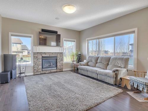 770 Lewis Greens Drive, Edmonton, AB - Indoor Photo Showing Living Room With Fireplace