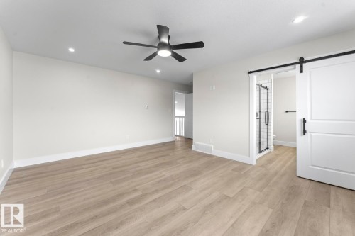 Spacious room featuring light wood-look flooring, recessed lighting, and a ceiling fan - 807 Schooner Drive, Cold Lake, AB - Indoor Photo Showing Other Room