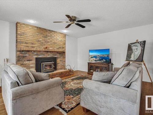 3020 105 Street, Edmonton, AB - Indoor Photo Showing Living Room With Fireplace