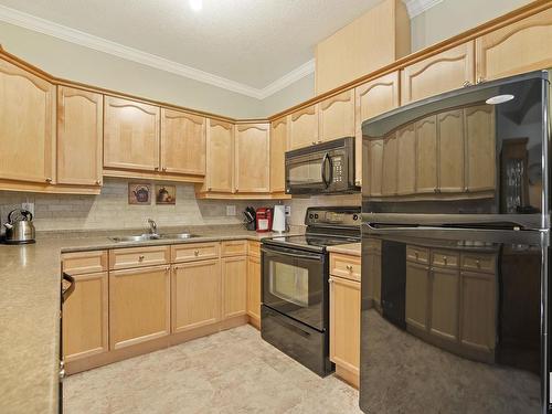 127 8528 82 Avenue, Edmonton, AB - Indoor Photo Showing Kitchen With Double Sink