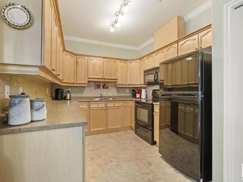 127 8528 82 Avenue, Edmonton, AB - Indoor Photo Showing Kitchen With Double Sink