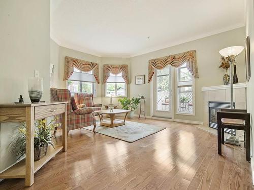 127 8528 82 Avenue, Edmonton, AB - Indoor Photo Showing Living Room With Fireplace