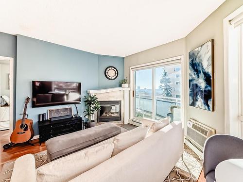 504 10504 99 Avenue, Edmonton, AB - Indoor Photo Showing Living Room With Fireplace