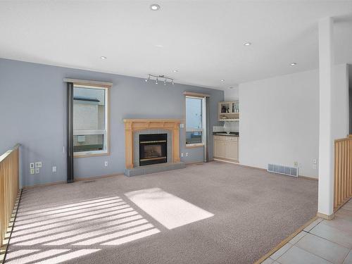 950 Burrows Crescent, Edmonton, AB - Indoor Photo Showing Living Room With Fireplace