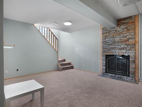 950 Burrows Crescent, Edmonton, AB - Indoor Photo Showing Other Room With Fireplace