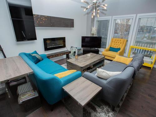 526 Orchards Boulevard, Edmonton, AB - Indoor Photo Showing Living Room With Fireplace