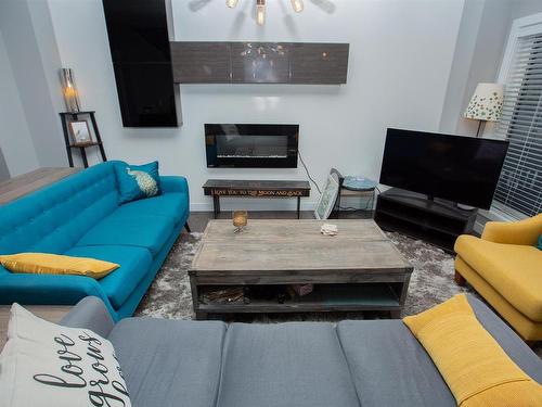 526 Orchards Boulevard, Edmonton, AB - Indoor Photo Showing Living Room With Fireplace