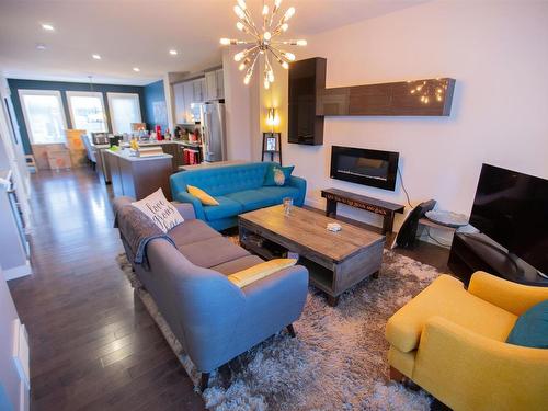 526 Orchards Boulevard, Edmonton, AB - Indoor Photo Showing Living Room With Fireplace