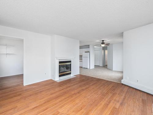 205 9138 83 Avenue, Edmonton, AB - Indoor Photo Showing Living Room With Fireplace