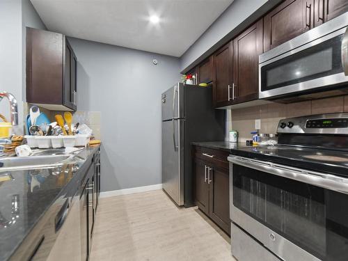 402 1510 Watt Drive, Edmonton, AB - Indoor Photo Showing Kitchen With Double Sink