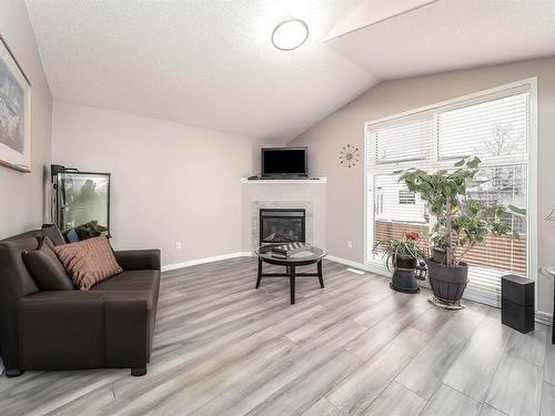 3709 22A Street, Edmonton, AB - Indoor Photo Showing Living Room With Fireplace